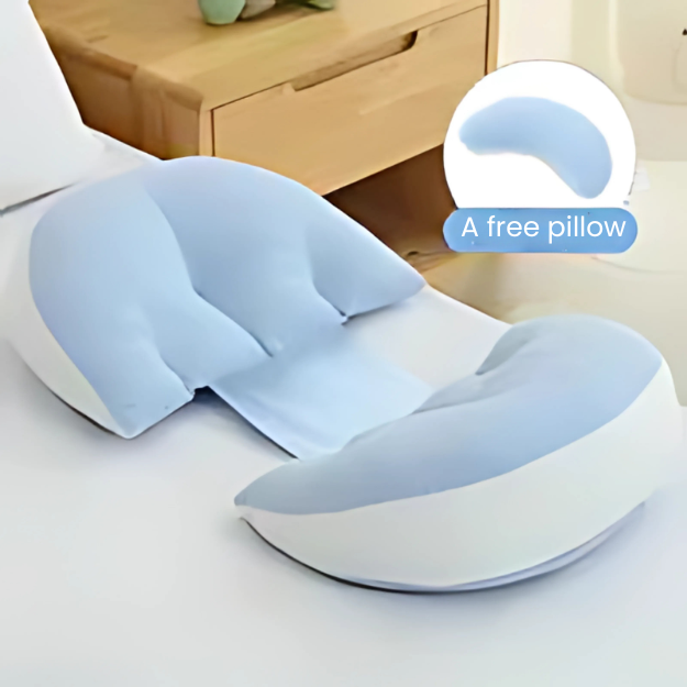 Adjustable Pregnancy Support Pillow in light blue and white on bed with wooden nightstand background