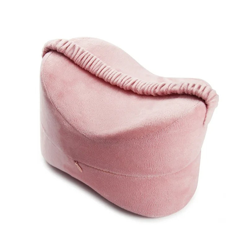 Soft pink memory foam Between Leg Pillow with a contoured shape for knee support and comfort