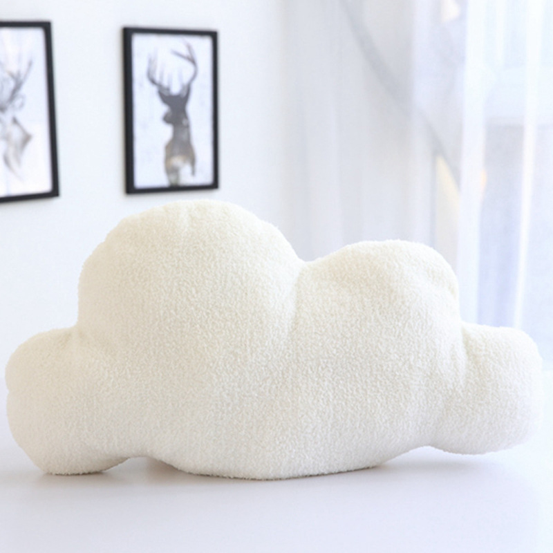 White cloud-shaped throw pillow with soft textured fabric perfect for cozy home decor