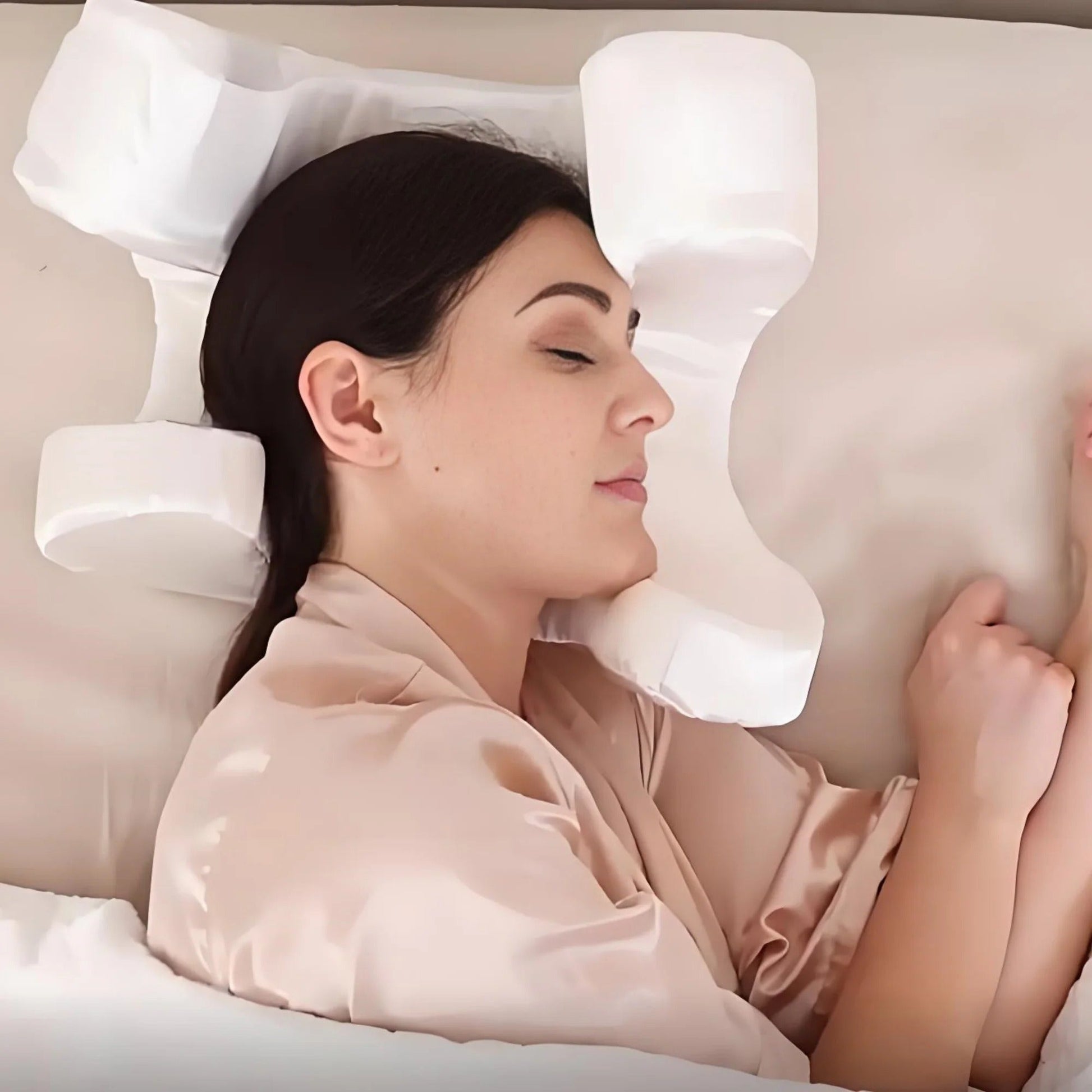 Woman sleeping comfortably using a white ergonomic Face Pillow from getblissyneck for neck and face support