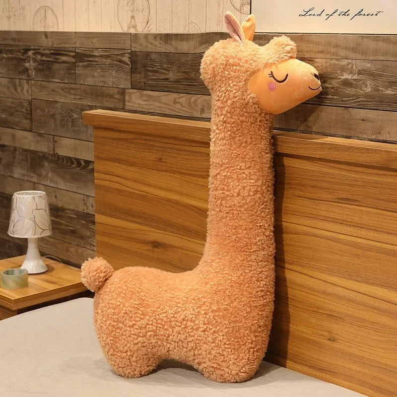 Cute plush llama shaped throw pillow with soft textured fabric for cozy home decor