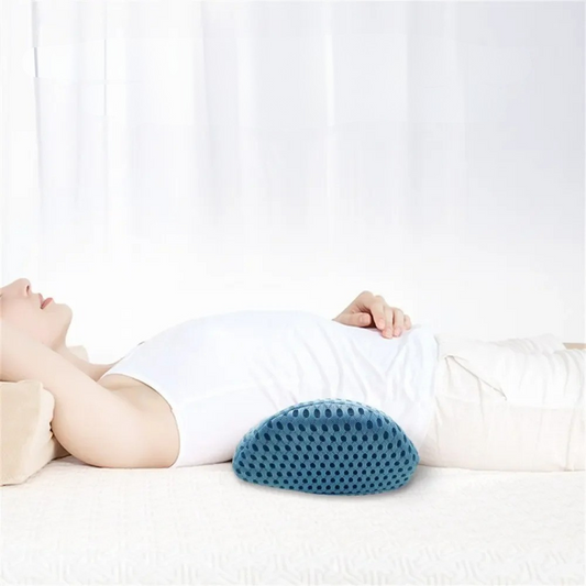 Lumbar Pillow on Bed in blue with textured surface supporting lower back of person lying down